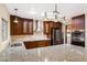 Beautiful kitchen with granite countertops, stainless steel appliances and modern lighting fixtures at 631 Leisure World --, Mesa, AZ 85206