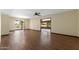 Spacious living area featuring hardwood floors and access to the covered patio and green backyard at 631 Leisure World --, Mesa, AZ 85206
