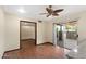 Bright living area featuring wood-look floors and sliding glass door to the outdoor patio at 631 Leisure World --, Mesa, AZ 85206
