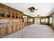 Spacious room with wood paneled walls and built-in cabinets, flowing onto outdoor patio at 631 Leisure World --, Mesa, AZ 85206
