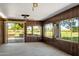 Spacious room with wood paneled walls and view of the golf course at 631 Leisure World --, Mesa, AZ 85206