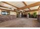 Inviting covered patio area with a brick floor, ceiling fans, and a stone privacy wall at 631 Leisure World --, Mesa, AZ 85206