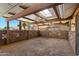 Spacious covered patio with brick flooring, ceiling fans, stone privacy wall, and inviting outdoor space at 631 Leisure World --, Mesa, AZ 85206