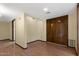 Neutral room with wood-look floors and large, double entry doors at 631 Leisure World --, Mesa, AZ 85206