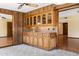 Unique wet bar with wood cabinetry and decorative hardware at 631 Leisure World --, Mesa, AZ 85206
