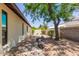 Backyard featuring desert landscaping with stone accents, offering a serene and low-maintenance outdoor space at 6417 E Kings Ave, Scottsdale, AZ 85254