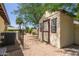 A backyard featuring a shed with a gravel surface and privacy fence, providing utility and seclusion at 6417 E Kings Ave, Scottsdale, AZ 85254