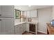 Cozy butler pantry featuring built-in wine storage and a marble countertop at 6417 E Kings Ave, Scottsdale, AZ 85254