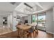 Chic dining room with elegant light fixture, wood table, and sliding glass doors at 6417 E Kings Ave, Scottsdale, AZ 85254