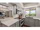 Modern kitchen featuring stainless steel appliances, updated cabinetry, and stylish countertops at 6417 E Kings Ave, Scottsdale, AZ 85254