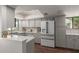 Modern kitchen featuring stainless steel appliances, updated cabinetry, and stylish countertops at 6417 E Kings Ave, Scottsdale, AZ 85254