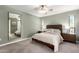 Comfortable bedroom showcases a plush carpet, soothing colors, and a large mirror, creating a peaceful retreat at 6417 E Kings Ave, Scottsdale, AZ 85254