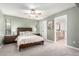 Serene bedroom featuring plush carpet, neutral tones, and an adjoining bathroom for added convenience at 6417 E Kings Ave, Scottsdale, AZ 85254