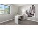 Bright office space with a white desk and a window bringing in natural light at 6417 E Kings Ave, Scottsdale, AZ 85254