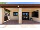 Covered patio showing an outdoor kitchen area with bar seating and access to the pool at 6417 E Kings Ave, Scottsdale, AZ 85254