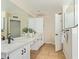 Bathroom featuring dual sinks, white cabinets, and a spacious counter area at 7108 W Morrow Dr, Glendale, AZ 85308