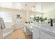 Bright bathroom featuring a bathtub, sink, vanity, and a white countertop at 7108 W Morrow Dr, Glendale, AZ 85308