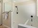 Bathroom featuring a glass shower, white tiles, and a separate bathtub at 7108 W Morrow Dr, Glendale, AZ 85308
