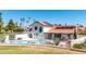 Exterior view of home featuring a refreshing swimming pool and desert landscaping at 7108 W Morrow Dr, Glendale, AZ 85308