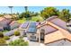 An aerial view of the lovely home with a red roof and solar panels at 7108 W Morrow Dr, Glendale, AZ 85308