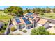 Aerial view of a lovely home featuring solar panels, a red tile roof, and desert landscaping at 7108 W Morrow Dr, Glendale, AZ 85308