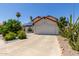 Charming single Gathering home with a two car garage, solar panels, and desert landscaping at 7108 W Morrow Dr, Glendale, AZ 85308