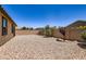 Low maintenance backyard with desert landscaping and privacy walls at 7665 W Fetlock Trl, Peoria, AZ 85383