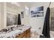Bathroom with granite counters, vanity sink, and a shower-tub combination at 7665 W Fetlock Trl, Peoria, AZ 85383