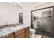 Stylish bathroom with granite vanity, glass shower, and modern fixtures at 7665 W Fetlock Trl, Peoria, AZ 85383