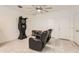 Spacious game room with tile flooring, recessed lighting, comfortable seating, and a dart board at 7665 W Fetlock Trl, Peoria, AZ 85383