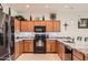 Well-lit kitchen featuring granite countertops, stainless steel appliances, and ample cabinet space at 7665 W Fetlock Trl, Peoria, AZ 85383