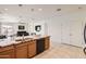 Open-concept kitchen offers a breakfast bar, stainless steel appliances, and an inviting atmosphere at 7665 W Fetlock Trl, Peoria, AZ 85383