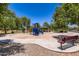 Neighborhood playground with colorful play structure and picnic area at 7665 W Fetlock Trl, Peoria, AZ 85383