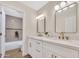 Modern bathroom featuring a double vanity with white countertops, gold fixtures, and stylish mirrors at 7685 W San Miguel Ave, Glendale, AZ 85303