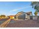 Charming single-story home featuring a two-car garage and desert landscaping in front at 7685 W San Miguel Ave, Glendale, AZ 85303