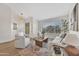 Bright living room with vaulted ceilings, wood-look floors, and elegant furniture at 7685 W San Miguel Ave, Glendale, AZ 85303