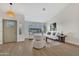 Bright living room with vaulted ceilings, wood-look floors, and elegant furniture at 7685 W San Miguel Ave, Glendale, AZ 85303