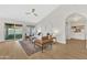 Bright living room with vaulted ceilings, wood-look floors, and access to the backyard at 7685 W San Miguel Ave, Glendale, AZ 85303
