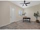 Bedroom features carpeted floors, a ceiling fan, and a window at 8027 W Northview Ave, Glendale, AZ 85303