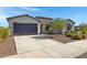 Charming single-story home with stone accents, a two-car garage, and a well-manicured front yard at 8027 W Northview Ave, Glendale, AZ 85303