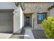 Close-up of front door featuring stone accents and a covered entryway at 8027 W Northview Ave, Glendale, AZ 85303