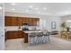 Bright kitchen features an island with seating, stainless steel appliances, and ample counter space at 8027 W Northview Ave, Glendale, AZ 85303