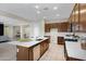 Charming kitchen featuring stainless steel appliances, an island with sink, and an open design at 8027 W Northview Ave, Glendale, AZ 85303