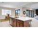 Kitchen with an island, stainless steel appliances, and easy access to outdoor living at 8027 W Northview Ave, Glendale, AZ 85303