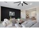 Inviting living room features a black accent wall, stylish furnishings, and an open layout at 8027 W Northview Ave, Glendale, AZ 85303