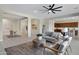 Spacious living room showcases an open-concept design with seamless flow to the dining and kitchen areas at 8027 W Northview Ave, Glendale, AZ 85303
