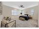 Inviting main bedroom with carpeted floors, a ceiling fan, and natural light at 8027 W Northview Ave, Glendale, AZ 85303