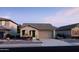 Charming single-story home with a two-car garage and well-maintained landscaping at 805 W Lark Dr # 243, Queen Creek, AZ 85140