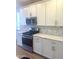 Modern kitchen featuring white cabinets, stainless steel appliances, and light countertops at 805 W Lark Dr # 243, Queen Creek, AZ 85140