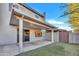Comfortable covered back patio and block wall for privacy, with artificial grass at 8619 N 67Th Dr, Peoria, AZ 85345